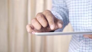 Businessman using digital tablet on office desk video