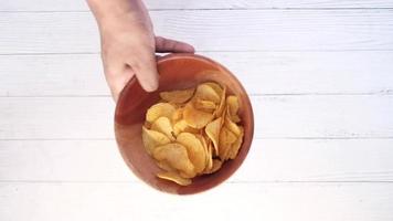 Holding a Bowl of tasty potato chips video