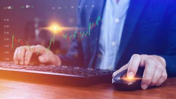 Businessman finger touch symbol stock graph and chart background, concept growth and development business investment, Stock market and strategy making market plan and stock market fluctuations photo