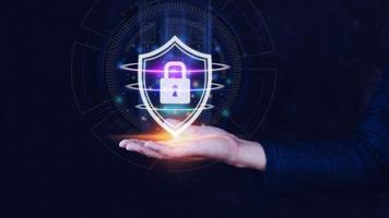 Computer network protection, secure and safe your data concept, businessman holding shield protection icon, Security shield Lock Security Businessman Protect Concept photo