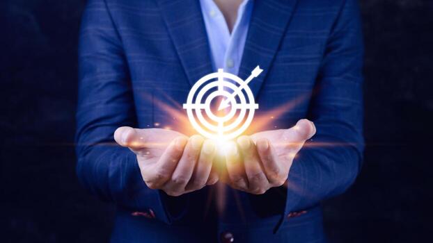 Targeting concept with businessman hand holding digital image of dartboard,Businessman holding virtual dartboard and arrow with copy space for setup business objective target concept. photo