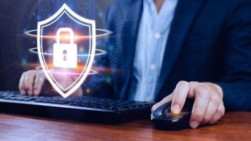 Computer network protection, secure and safe your data concept, businessman holding shield protection icon, Security shield Lock Security Businessman Protect Concept photo