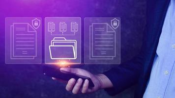 Document Management System DMS being setup IT consultant working on smartphone. Software for archiving, searching and managing corporate files information photo