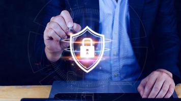 Computer network protection, secure and safe your data concept, businessman holding shield protection icon, Security shield Lock Security Businessman Protect Concept photo