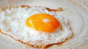 Fried eggs in the plate close up ,, video