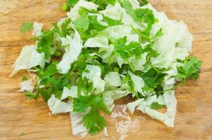 Sliced  lettuce Coriander on wooden board photo