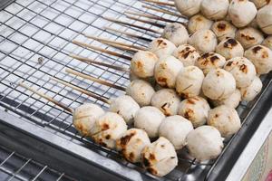 Street food meat ball sticks on grill at Thailand photo