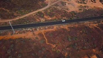 Top view of a car rides along a desert road on Tenerife, Canary Islands, Spain video