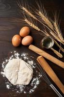 top view bakery and cooking bread pastry or cake ingredients in wooden table background with copy space. homemade photo