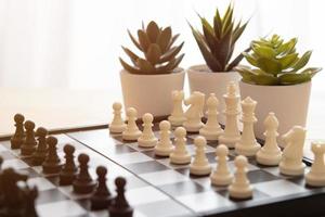 chess pieces on a chessboard for ideas and competition and strategy. business success concept photo