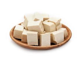 pile of white cube Tofu in wood plate isolated on white background. fresh white cube tofu isolated on background. heap of white cube tofu isolated on background photo