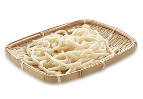 close up udon noodle in wood bowl isolated on white background with clipping path photo