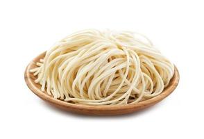 raw ramen noodle in wood plate isolated on white background. fresh egg ramen noodles isolated on white background. Japanese food ramen noodles isolated on white background photo