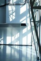 shadow and light reflection inside the building view and moving escalator photo