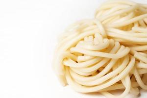 close up ramen or soba noodles on white background with copy space photo
