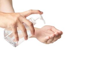 a man washing hands with alcohol gel or antibacterial soap sanitizer to prevent corona virus isolated on white background with clipping path photo