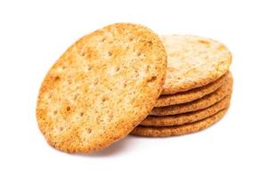 Baked round cracker chips isolated on white background. Wheat cracker chips isolated on white background. Whole wheat cracker isolated on white background with clipping path photo