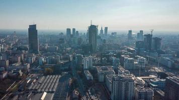 View from the height on Warsaw business center, skyscrapers, buildings and cityscape in the morning fog. Hyper-lapse video