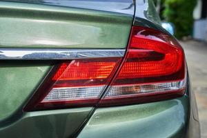 close up rear led light in a green car. brake, background, performance, rear, light, led photo