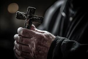 Church priest holds religious cross in hands. photo