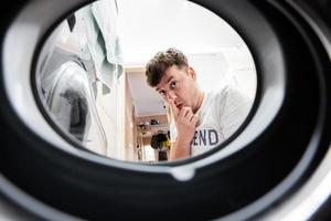 Man view from washing machine inside. photo