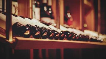 bottles of wine in wine bar or wine shop for soft background photo