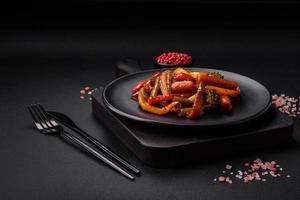 Mix of vegetables corn, carrots, peppers, broccoli, onions in teriyaki sauce photo