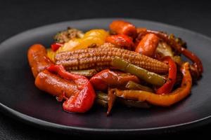 Mix of vegetables corn, carrots, peppers, broccoli, onions in teriyaki sauce photo