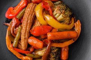 Mix of vegetables corn, carrots, peppers, broccoli, onions in teriyaki sauce photo