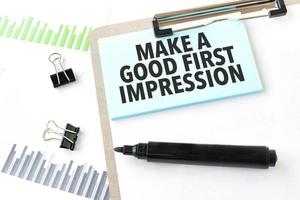 Paper plate, marker, diagram, chart and office tools. Text Make a good first impression photo