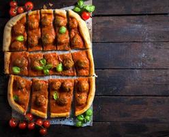 Sliced meatballs pizza photo