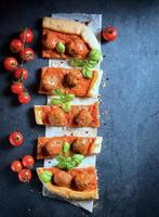 Meatballs and tomato sauce in pastry photo