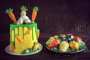 Easter cake and strawberries served on the wooden background photo