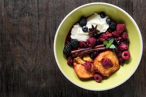 Grilled berries and peaches with mascarpone cheese cream photo