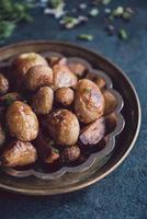 Fried potatoes in the plate photo