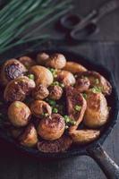 Fried potatoes with chive photo