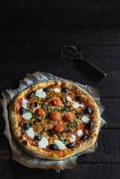 Mozzarella and cherry pizza photo