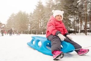 Child on sled photo