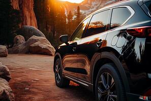 Electric suv cars parked in the view point with mountains in the background. photo