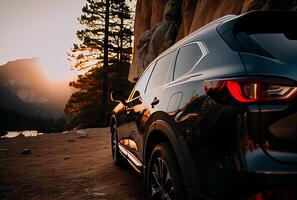 Electric suv cars parked in the view point with mountains in the background. photo