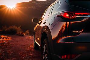 Electric suv cars parked in the view point with mountains in the background. photo