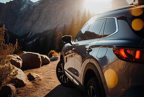 Electric suv cars parked in the view point with mountains in the background. photo