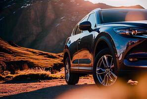 Electric suv cars parked in the view point with mountains in the background. photo