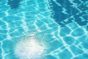 Pool water surface background with sunlight reflection. photo