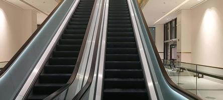 Slowmoving empty elevator stairs shop mall,stairs elevator with glass railling and shiny metal moving up and down video