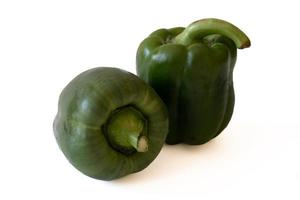 Green sweet bell pepper with water drops isolated on white background. photo