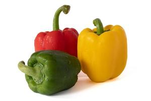 Sweet bell pepper  with water drops isolated on white background. photo