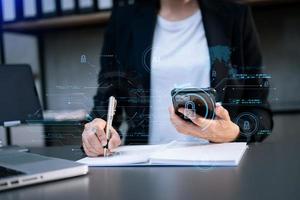 Cyber security and data protection. Business using computer and  tablet protecting business and financial data with virtual from cyber attack, cybersecurity technology in office photo