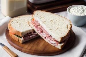 Sandwich with ham, cheese and salad on a white plate. sandwich with tuna and vegetables. photo