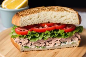 Sandwich with ham, cheese and salad on a white plate. sandwich with tuna and vegetables. photo